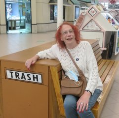 Why did Gloria ask me to sit there for my photo?